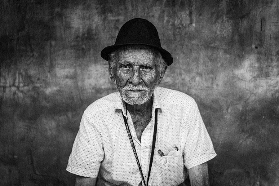 What are the best street photography books that provide tips on how to approach strangers for photos?